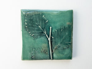 unique arts and crafts tile with tree leaf